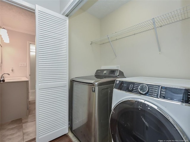 494 Wilder Dr, Fayetteville, NC 28314 - laundry room with a sink, washing machine and dryer, and laundry area