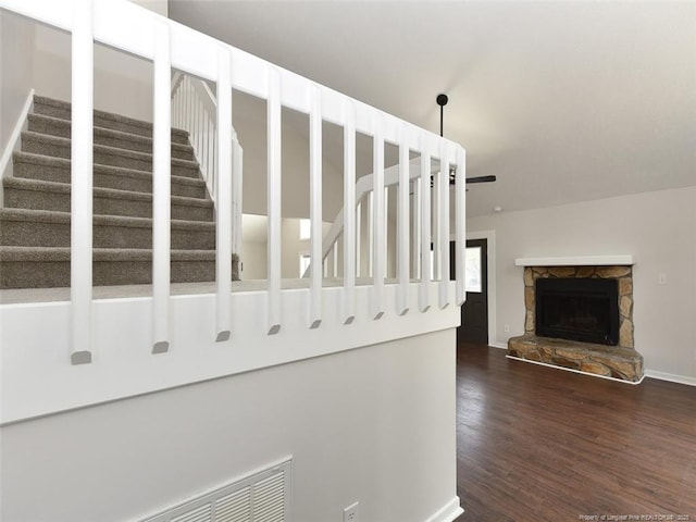 494 Wilder Dr, Fayetteville, NC 28314 - staircase with baseboards, wood finished floors, and a fireplace