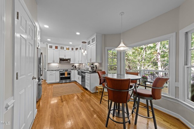 2520 Ashley Ct, Raleigh, NC 27607 - dining space featuring light wood-style floors, plenty of natural light, and recessed lighting