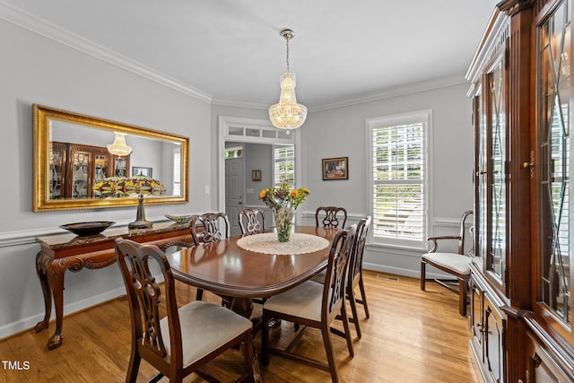 2520 Ashley Ct, Raleigh, NC 27607 - dining area featuring light wood-style flooring, visible vents, and ornamental molding