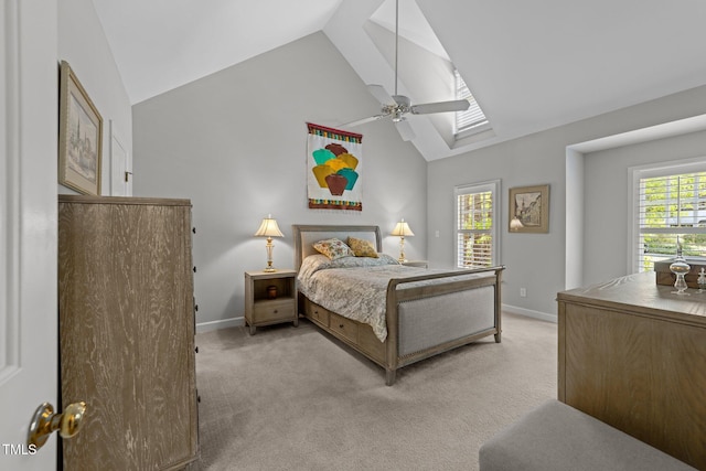 2520 Ashley Ct, Raleigh, NC 27607 - bedroom featuring baseboards, a ceiling fan, a skylight, high vaulted ceiling, and light carpet