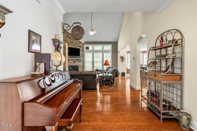12808 Edsel Dr, Raleigh, NC 27613 - interior space with baseboards, high vaulted ceiling, arched walkways, and wood finished floors