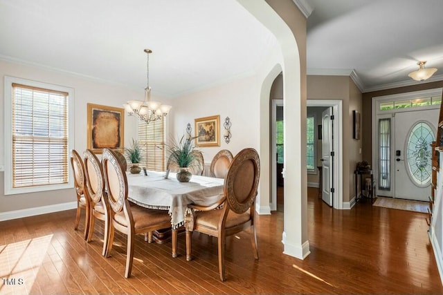 12808 Edsel Dr, Raleigh, NC 27613 - dining room with baseboards, arched walkways, plenty of natural light, and wood finished floors