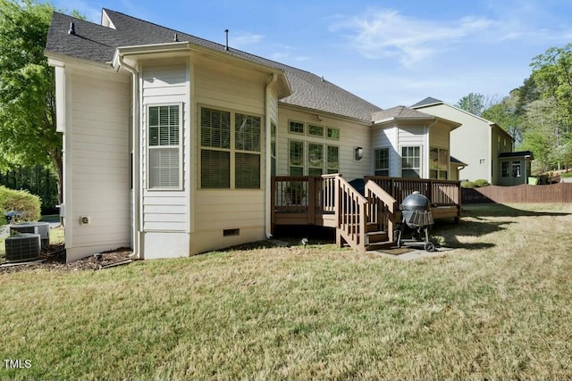 12808 Edsel Dr, Raleigh, NC 27613 - back of house featuring a deck, a lawn, crawl space, and roof with shingles