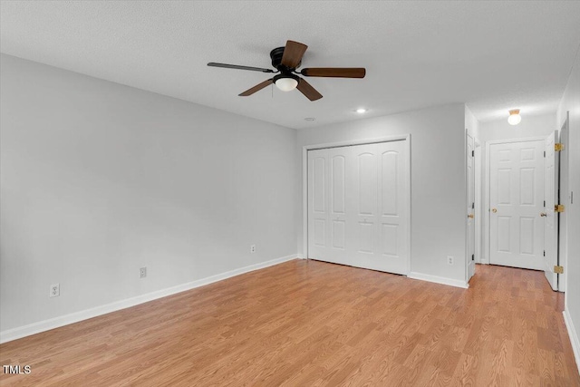 1517 Laughridge Dr, Cary, NC 27511 - unfurnished bedroom featuring light wood-style floors, baseboards, a closet, a ceiling fan, and recessed lighting