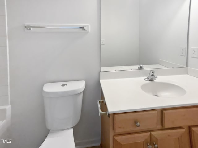 full bath featuring vanity and toilet