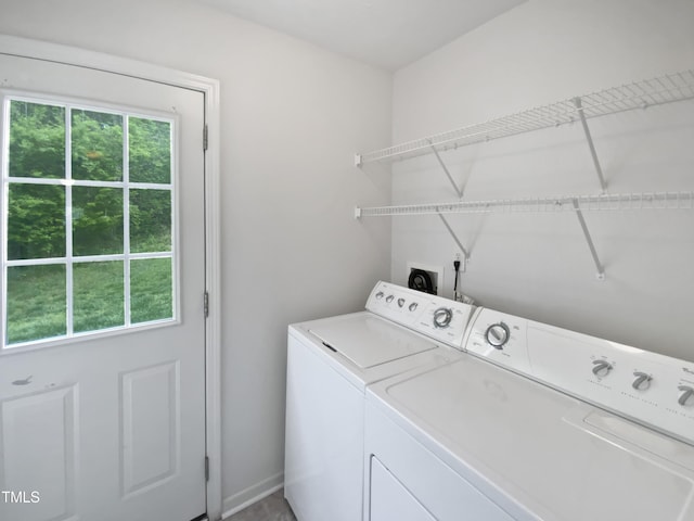 laundry area with washer and clothes dryer and laundry area