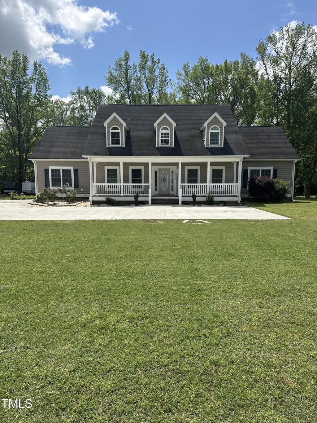 6283 Harrisontown Rd, Rocky Mount, NC 27804 - cape cod-style house with a front yard and a porch