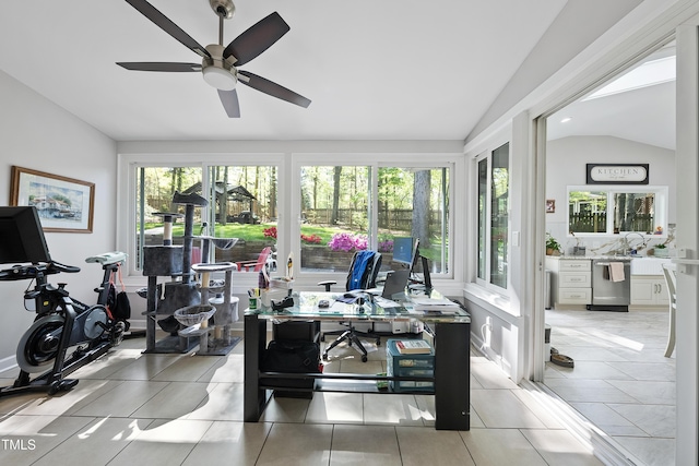 interior space featuring a wealth of natural light, tile patterned flooring, and vaulted ceiling
