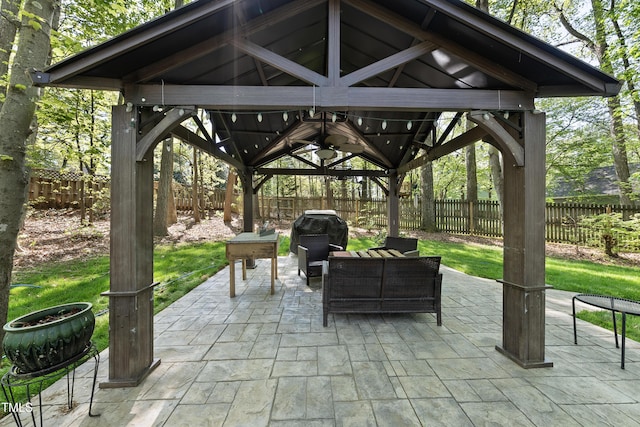 view of patio / terrace featuring a grill, a gazebo, and a fenced backyard