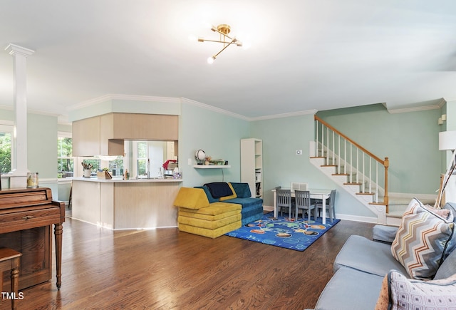 living area with stairway, ornamental molding, and wood finished floors