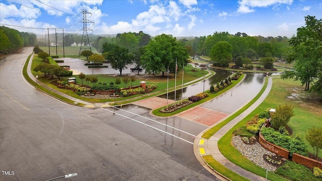 view of community featuring uncovered parking