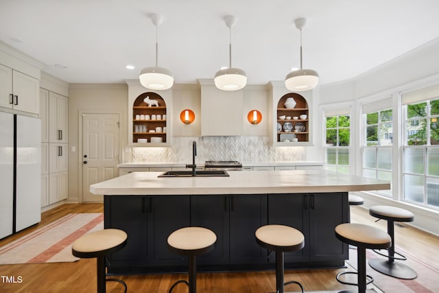 3332 Cheswick Dr, Raleigh, NC 27609 - kitchen featuring white fridge, light countertops, a sink, and open shelves