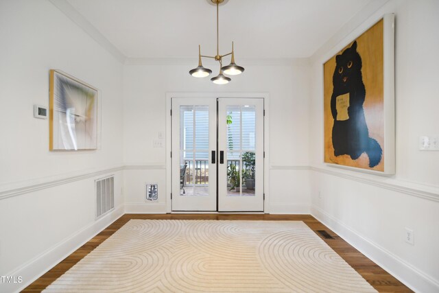 3332 Cheswick Dr, Raleigh, NC 27609 - doorway to outside featuring visible vents, baseboards, and dark wood finished floors