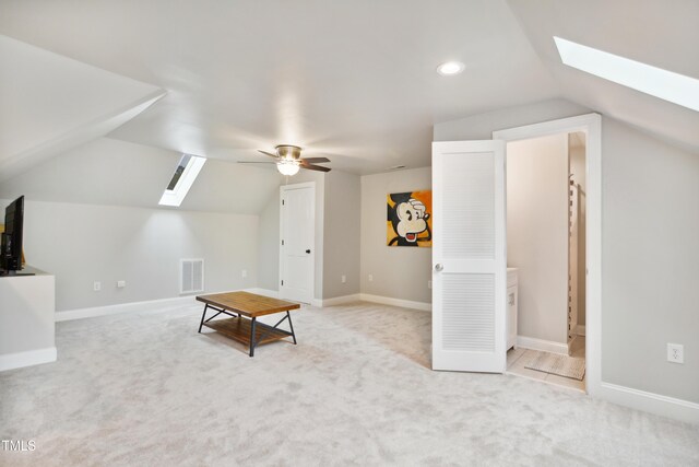 3332 Cheswick Dr, Raleigh, NC 27609 - additional living space featuring light colored carpet, a ceiling fan, visible vents, and lofted ceiling with skylight