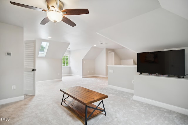 3332 Cheswick Dr, Raleigh, NC 27609 - additional living space featuring light carpet, vaulted ceiling with skylight, baseboards, and a ceiling fan