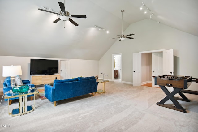 3332 Cheswick Dr, Raleigh, NC 27609 - living area featuring high vaulted ceiling, ceiling fan, rail lighting, light colored carpet, and baseboards