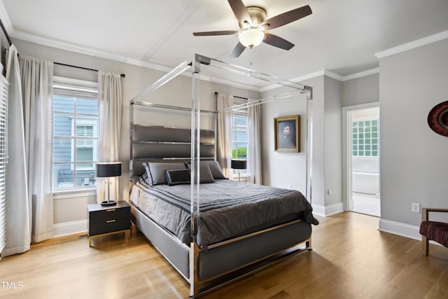 3332 Cheswick Dr, Raleigh, NC 27609 - bedroom featuring ornamental molding, light wood-type flooring, multiple windows, and baseboards