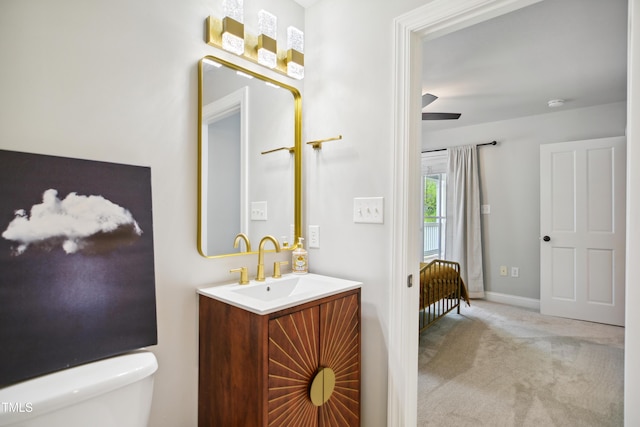3332 Cheswick Dr, Raleigh, NC 27609 - half bathroom featuring toilet, vanity, and baseboards