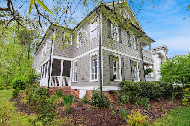 3332 Cheswick Dr, Raleigh, NC 27609 - view of side of home with a sunroom
