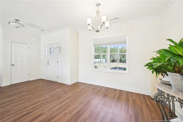 2140 Smith Rd, Hope Mills, NC 28348 - unfurnished dining area featuring crown molding, an inviting chandelier, visible vents, wood finished floors, and baseboards