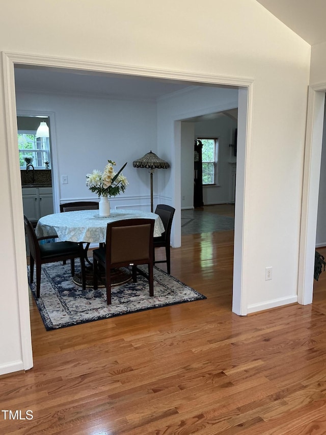 dining area featuring baseboards and wood finished floors