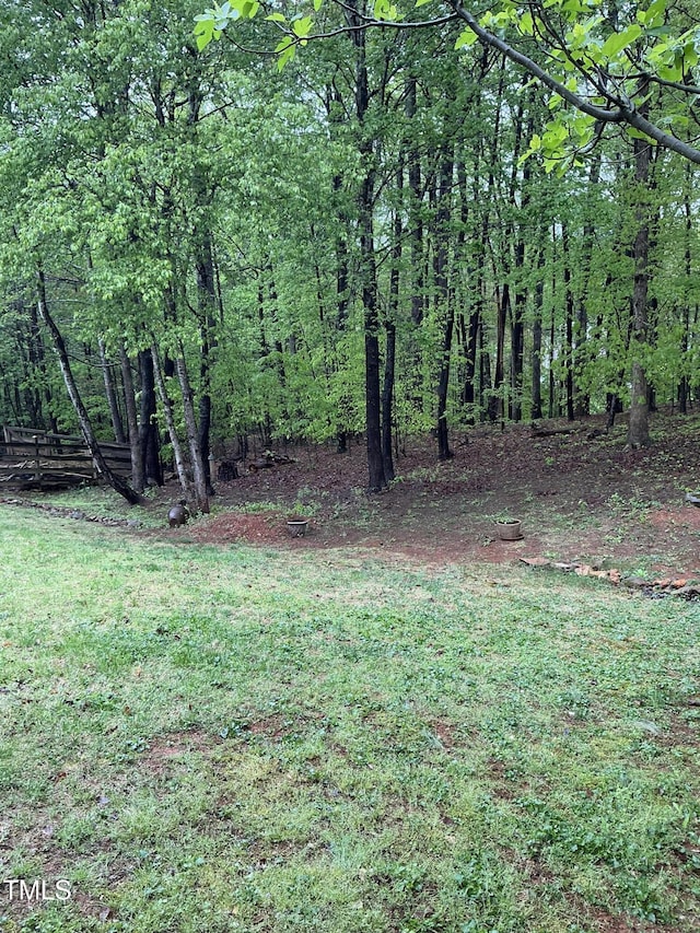 view of yard with a wooded view