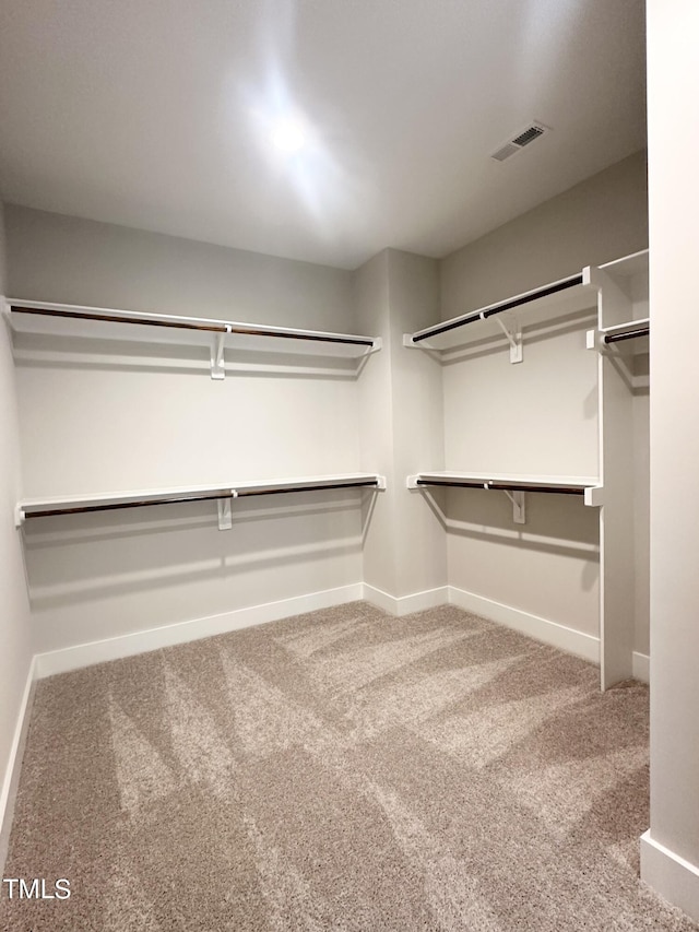 walk in closet with carpet flooring and visible vents