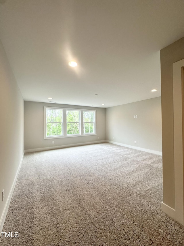 unfurnished room with baseboards, recessed lighting, and carpet flooring