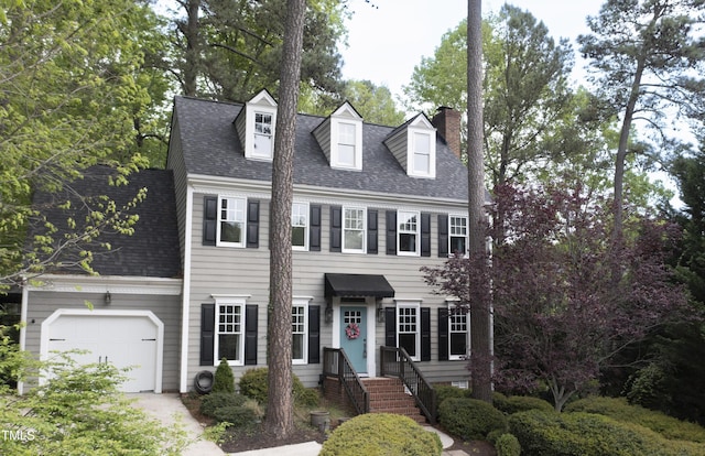 117 Vicksburg Dr, Cary, NC 27513 - colonial inspired home featuring roof with shingles, a chimney, and concrete driveway