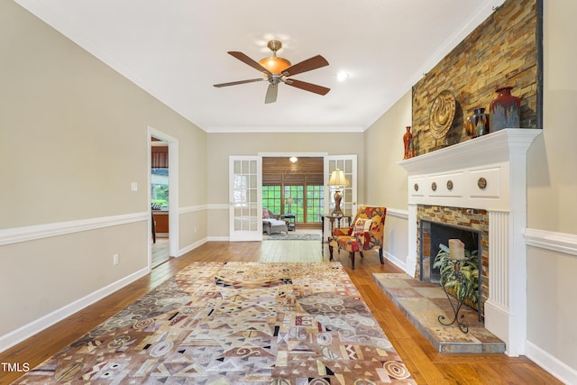 117 Vicksburg Dr, Cary, NC 27513 - living area with crown molding, a ceiling fan, hardwood / wood-style floors, and a fireplace