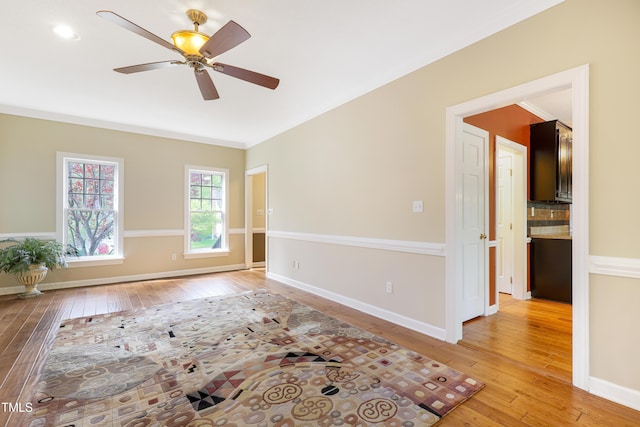 117 Vicksburg Dr, Cary, NC 27513 - unfurnished room with crown molding, light wood finished floors, baseboards, and a ceiling fan