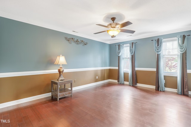 117 Vicksburg Dr, Cary, NC 27513 - empty room with wood finished floors, crown molding, baseboards, and ceiling fan