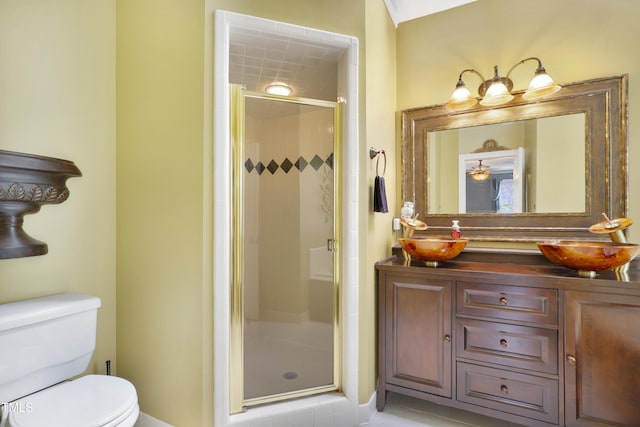 117 Vicksburg Dr, Cary, NC 27513 - bathroom featuring tile patterned floors, vanity, a shower stall, and toilet