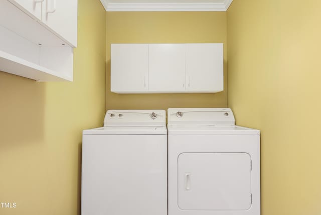 117 Vicksburg Dr, Cary, NC 27513 - laundry area featuring cabinet space, washing machine and dryer, and ornamental molding