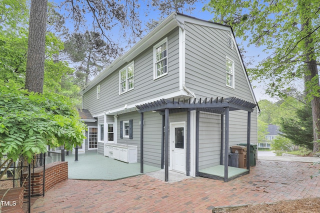117 Vicksburg Dr, Cary, NC 27513 - back of property featuring a pergola and a patio area