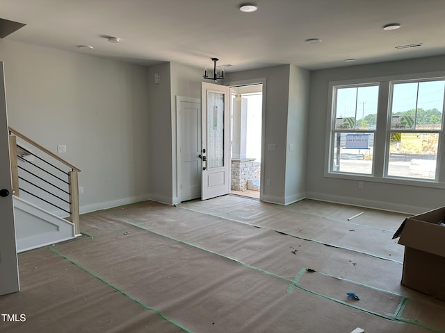 3020 White Rail Dr, Fuquay Varina, NC 27526 - entryway with stairs and a chandelier