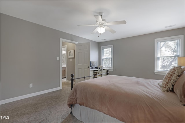 bedroom featuring light colored carpet, baseboards, and ceiling fan