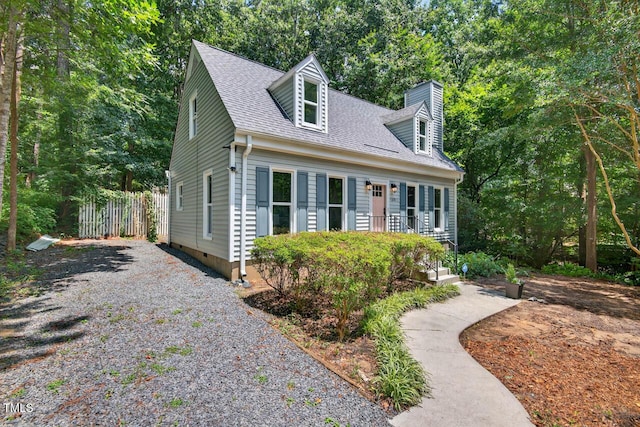1500 Valley, Durham, NC 27707 - new england style home featuring gravel driveway, a shingled roof, and a chimney