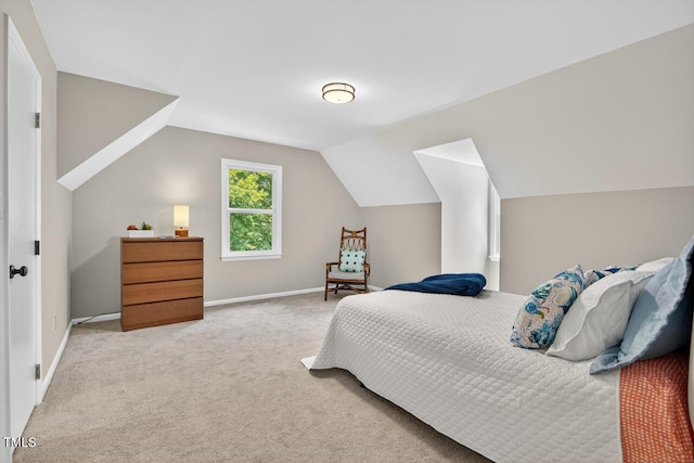 1500 Valley, Durham, NC 27707 - carpeted bedroom featuring vaulted ceiling and baseboards