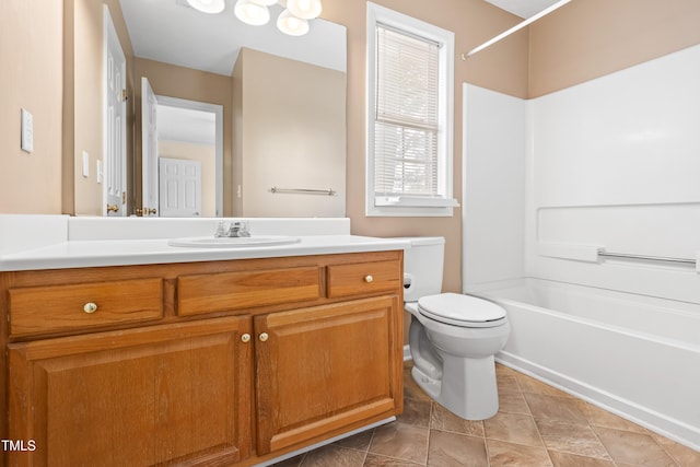 full bathroom with tile patterned floors, toilet, vanity, and  shower combination