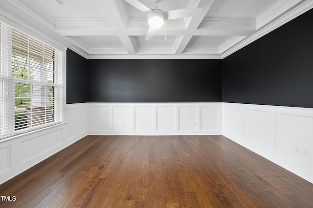 spare room with a decorative wall, ceiling fan, crown molding, beamed ceiling, and coffered ceiling