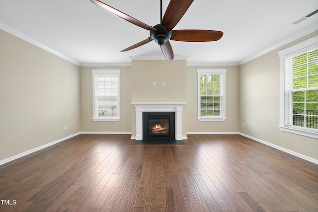 unfurnished living room with a wealth of natural light, ceiling fan, and a fireplace with flush hearth