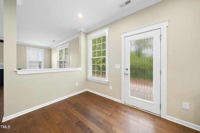 entryway featuring visible vents, baseboards, ornamental molding, recessed lighting, and wood-type flooring