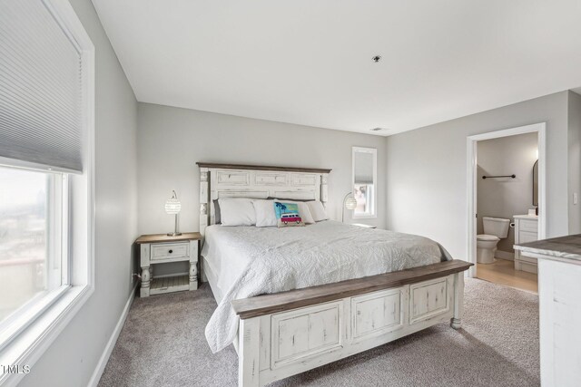 790 New River Inlet Rd Unit 113B, North Topsail Beach, NC 28460 - carpeted bedroom featuring ensuite bath and baseboards