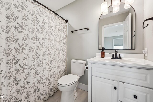 790 New River Inlet Rd Unit 113B, North Topsail Beach, NC 28460 - bathroom featuring tile patterned flooring, toilet, vanity, and a shower with curtain