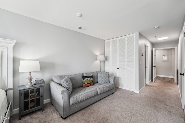 790 New River Inlet Rd Unit 113B, North Topsail Beach, NC 28460 - living room featuring baseboards, visible vents, and carpet floors
