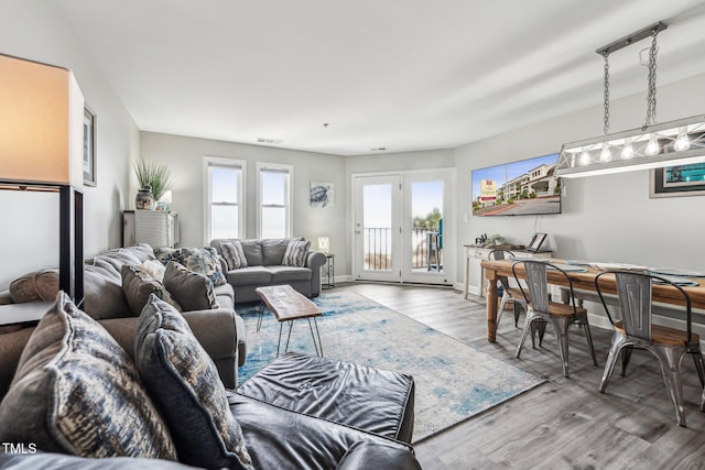 790 New River Inlet Rd Unit 113B, North Topsail Beach, NC 28460 - living room featuring wood finished floors, visible vents, and baseboards
