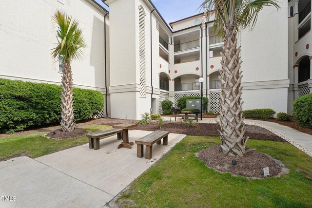 790 New River Inlet Rd Unit 113B, North Topsail Beach, NC 28460 - view of home's community with a lawn