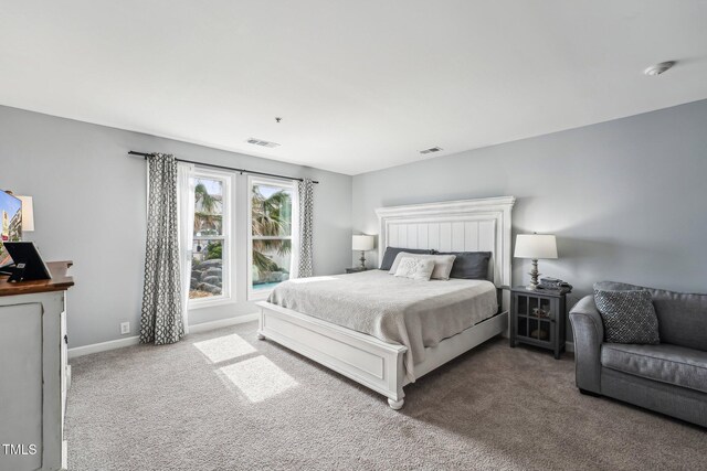 790 New River Inlet Rd Unit 113B, North Topsail Beach, NC 28460 - bedroom with carpet floors, visible vents, and baseboards